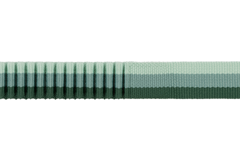 Detail of Green ribbon with a subtle pattern on a white background