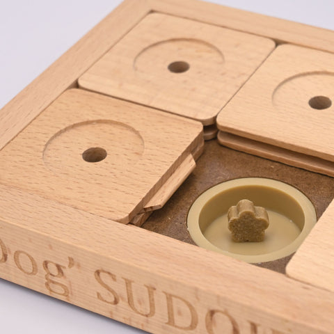 Wooden puzzle with engraved text on a light gray background