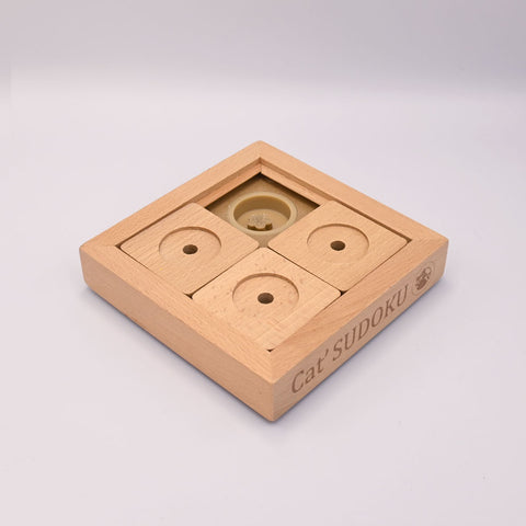 Wooden puzzle toy with 'Cat Sudoku' branding on a light gray background