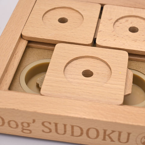 Wooden puzzle with circular cutouts and 'Dog Sudoku' branding.