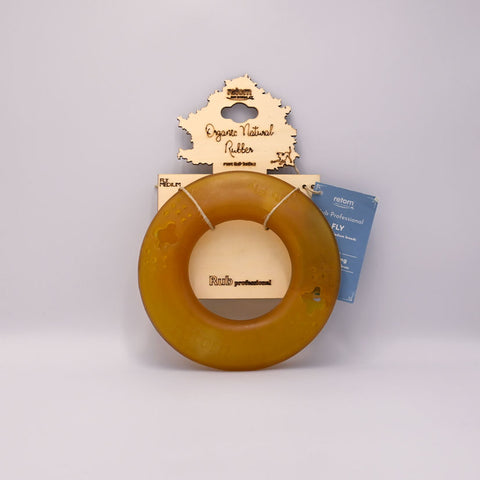 Round amber-colored Dog frisbee toy on a Grey background with visible branding.