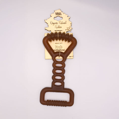 Natural rubber tug dog toy with a wooden label on a light Grey background.