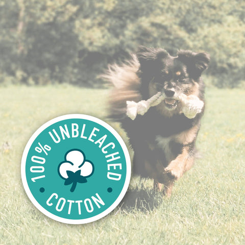 Dog running with a bone in its mouth on grass, with a '100% Unbleached Cotton' logo overlay.