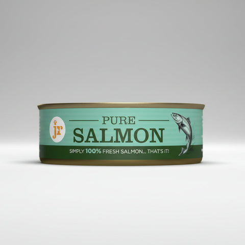Can of pure salmon with a green label on a white background