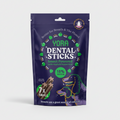 A stand-up pouch of YORA Dental Sticks insect-powered dog treats on a plain white background. The packaging is dark purple with green and white text and graphics, including a cartoon dog and a depiction of the treats inside.