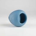 Blue rubber ball with a central hole on a white background