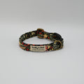 Dog collar with floral pattern and 'Barkley & Fetch' label on a neutral background.