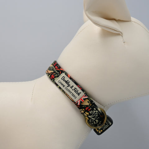 Dog collar with floral pattern and brand name on a mannequin neck.