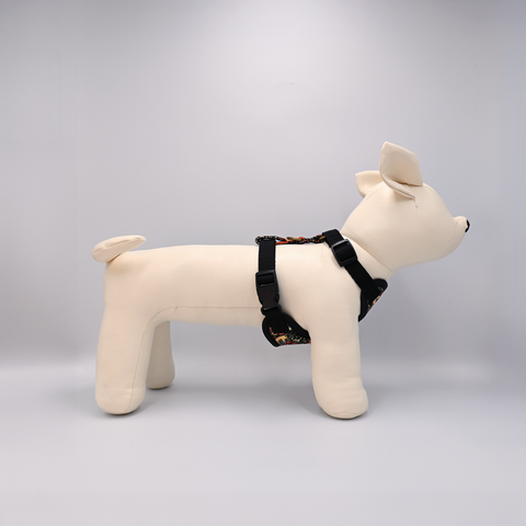 Dog toy with a black harness on a White background