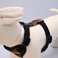 Black dog harness with floral pattern on a mannequin