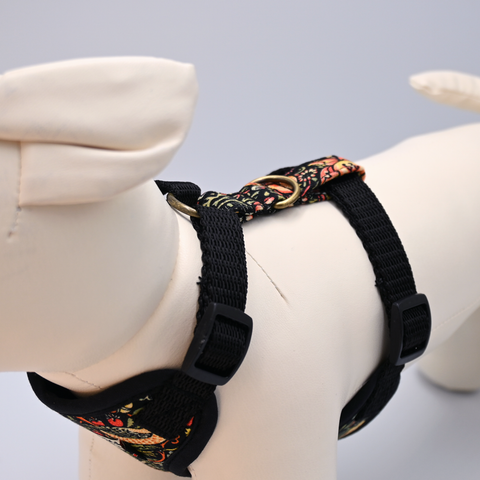 Black dog harness with floral pattern on a mannequin