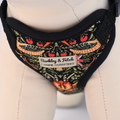 Dog harness with decorative pattern and 'Barkley & Fetch' label on a mannequin.