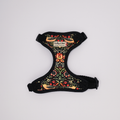 Decorative dog harness with floral pattern on a white background