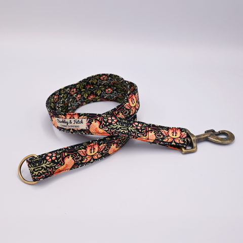 Floral patterned dog leash on a light Grey background