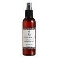 Wild Wash natural pet care spray bottle on a white background