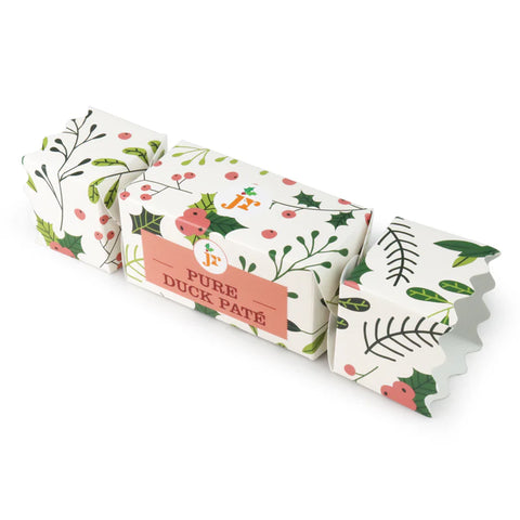 Packaged product with floral design and 'Pure Duck Páté' text on a white background