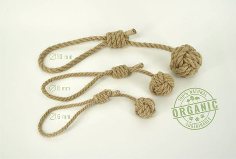 An organic Monkeyfist hemp rope dog toy with adjustable handle, displayed in three different sizes with measurements marked on the ropes.
