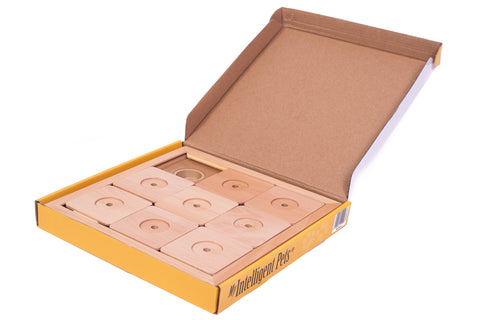 Open cardboard box with circular objects inside on a white background