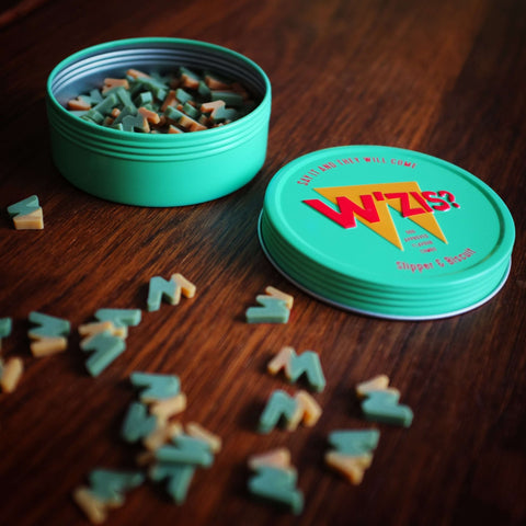 Close-up of W'ZIS Slipper & Biscuit vegan dog treats — Sparkly Tails