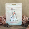 Gizzils Stuffed Turkey packaging with festive design on a wooden surface.