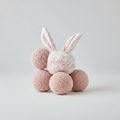 Pink bunny ear headband with a fluffy ball on a white background