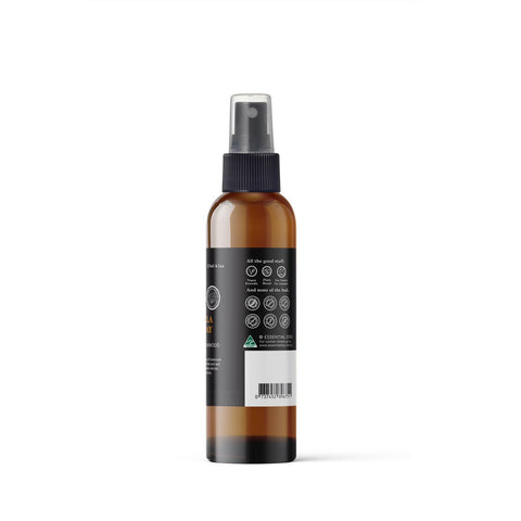 Brown spray bottle with a black label on a white background
