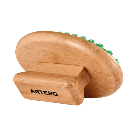 Bamboo Rubber Mitt Brush For Cats And Dogs, Artero Laika with green bristles on a white background, branded 'Artero'.
