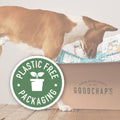 Dog interacting with a box labeled 'Goodchap's' with a plastic-free packaging logo.