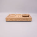 Wooden dog Sudoku puzzle on a light gray background
