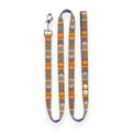 Colorful patterned dog leash on a white background