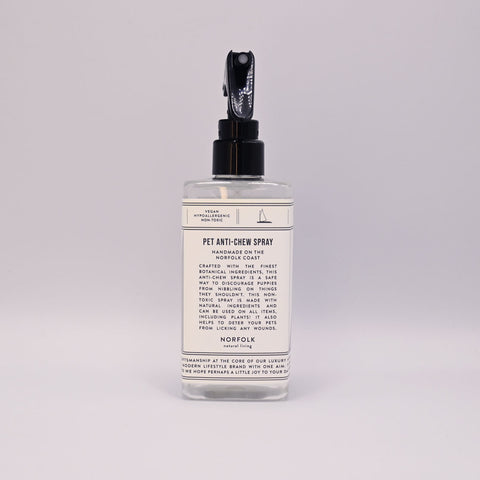 Pet anti-chew spray bottle with label on a light grey background