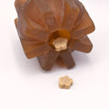 Brown pet chew toy with treats inside on a white background