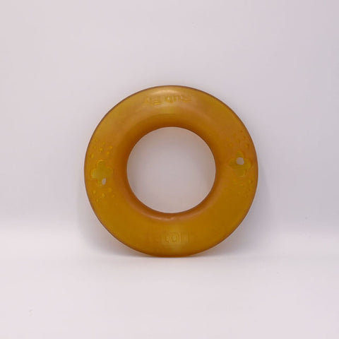 Brown rubber dog Frisbee ring toyon a white background.