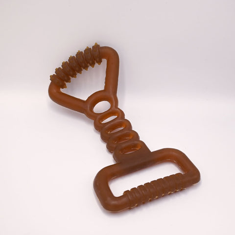 Natural rubber tug dog toy with a  on a light White background.