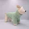 Dog mannequin with a Green sweater on a Grey background