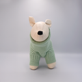 Dog mannequin with a Green sweater on a Grey background