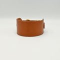 Brown leather bracelet on a light background