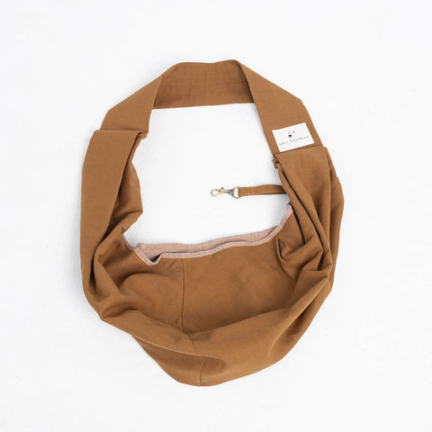 Brown dog harness on a white background